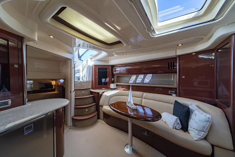 Slide: The Image of Luxurious interior of 2008 Sea Ray 440 Sundancer yacht with elegant seating and skylight. - 15