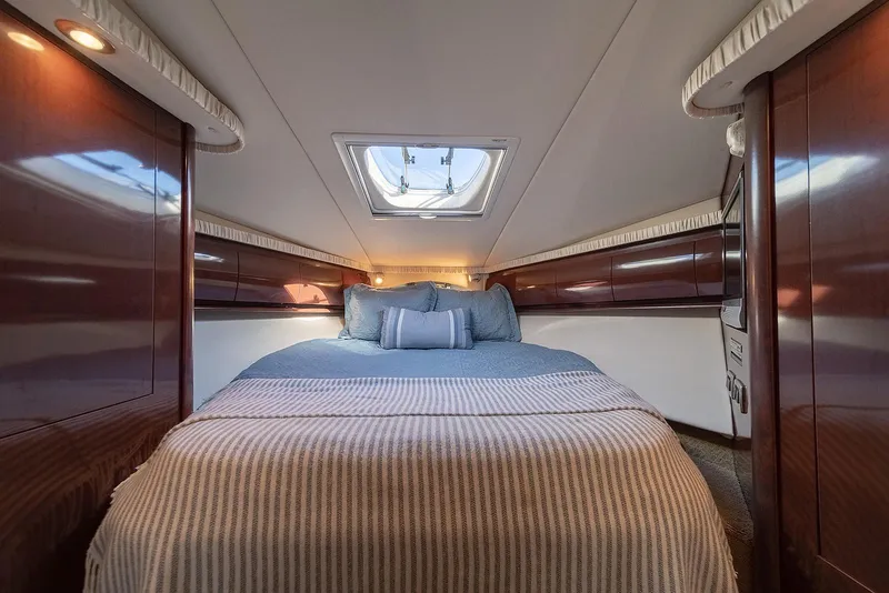 Slide: The Image of Luxurious cabin interior of 2008 Sea Ray 440 Sundancer yacht with cozy bedding. - 17