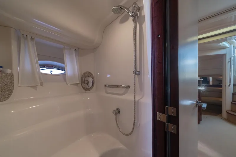 Slide: The Image of Luxurious bathroom in 2008 Sea Ray 440 Sundancer yacht, featuring a modern shower. - 19