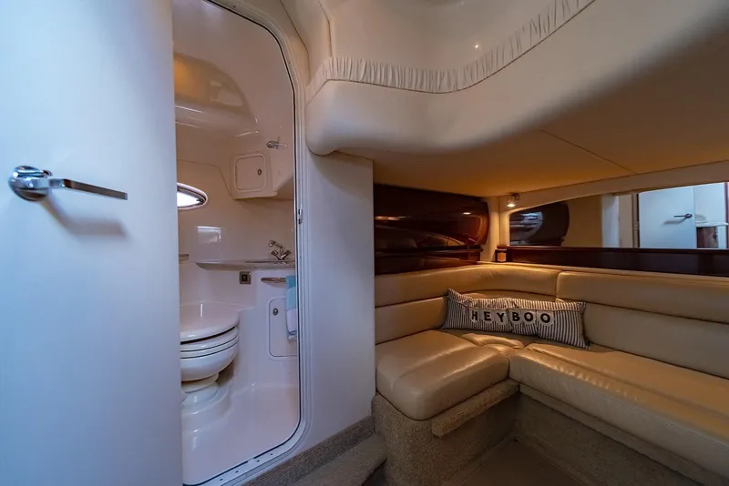 Slide: The Image of Interior of 2008 Sea Ray 440 Sundancer yacht with cozy seating and bathroom. - 22