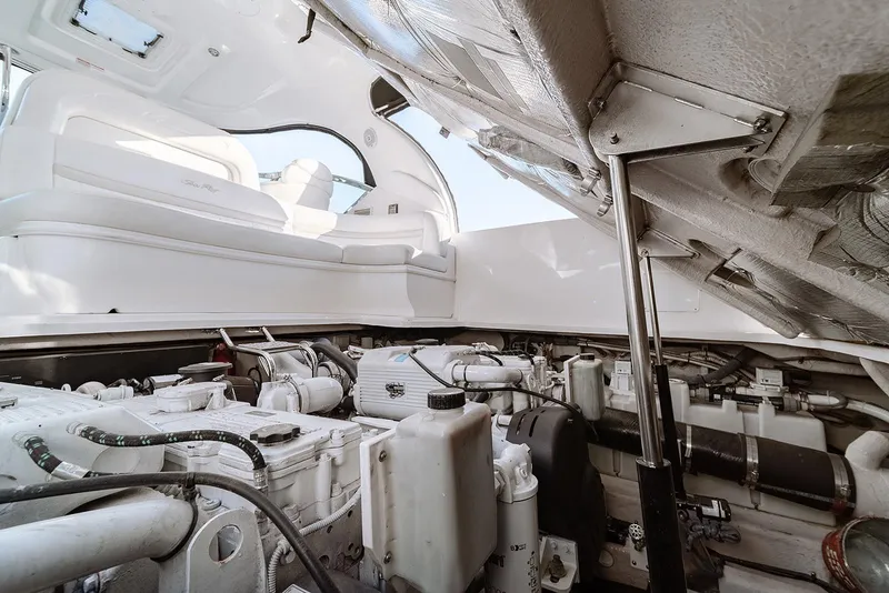 Slide: The Image of Engine compartment of a 2008 Sea Ray 440 Sundancer yacht, showcasing mechanical components. - 25