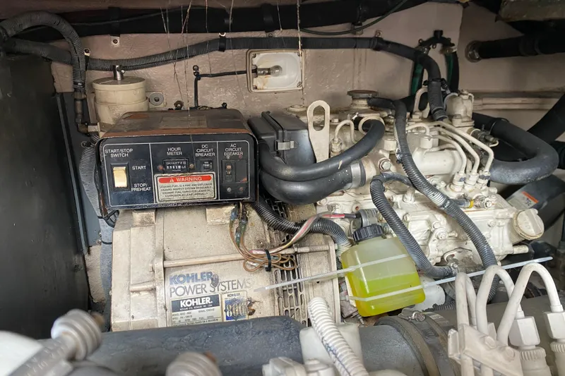 Slide: The Image of Engine compartment of a 2004 Sea Ray 380 Sundancer with Kohler power system. - 12