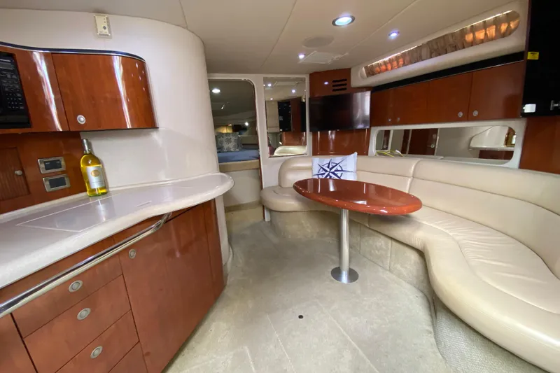 Slide: The Image of Luxurious interior of 2004 Sea Ray 380 Sundancer yacht with elegant seating and cabinetry. - 15