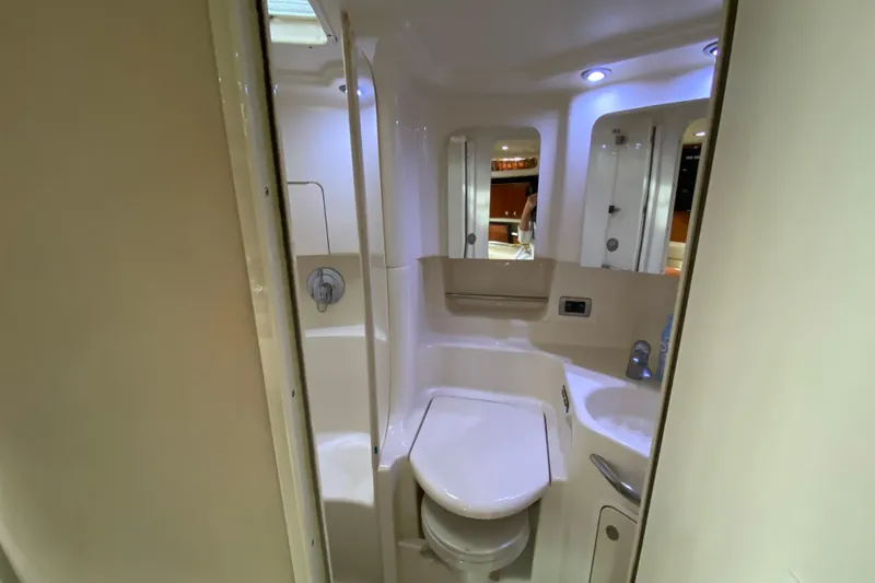Slide: The Image of Bathroom interior of 2004 Sea Ray 380 Sundancer yacht, featuring modern fixtures and lighting. - 19