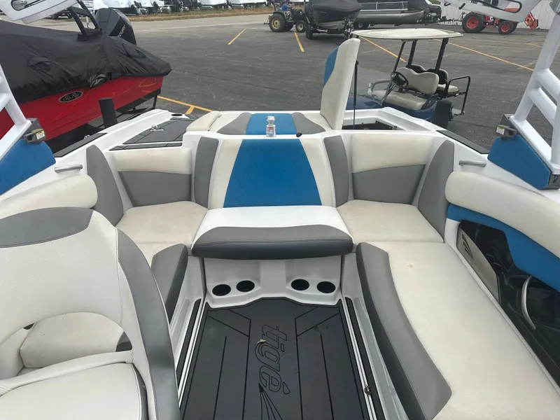 Slide: The Image of Interior of a 2016 Tigé R20 boat with blue and gray seating. - 11