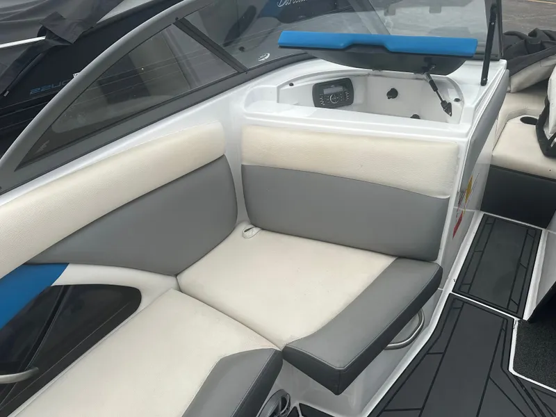 Slide: The Image of Interior of a 2016 Tigé R20 boat with gray and white seating. - 13