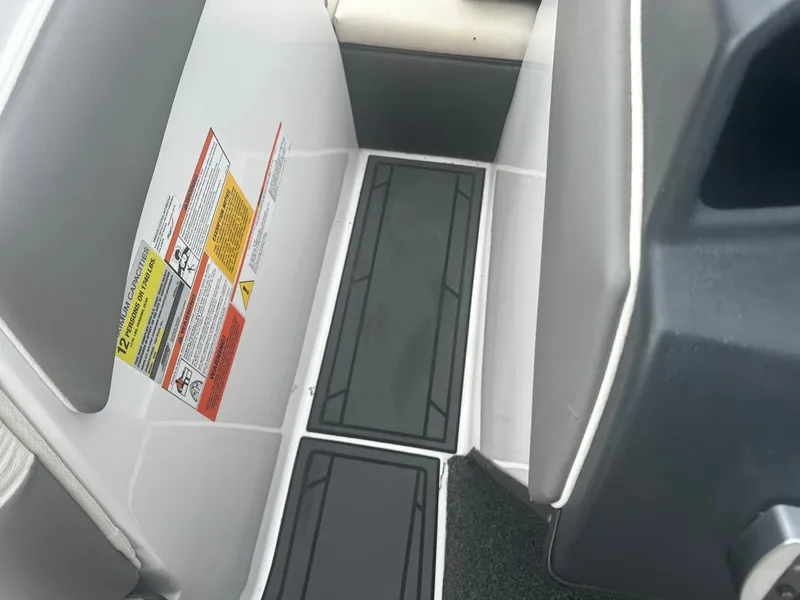 Slide: The Image of Interior of a 2016 Tigé R20 boat with capacity notice. - 17