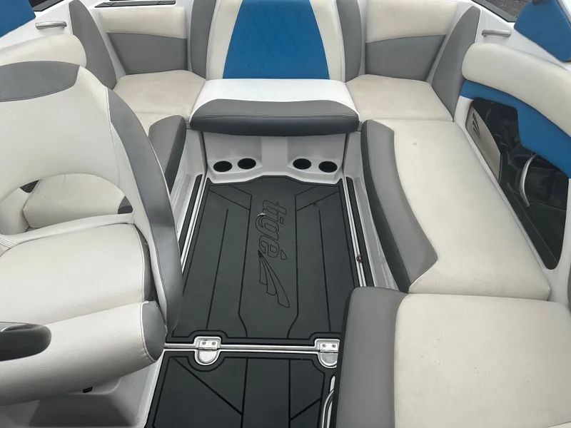 Slide: The Image of Interior of a 2016 Tigé R20 boat with blue and gray seating. - 19
