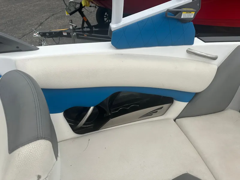 Slide: The Image of Interior of a 2016 Tigé R20 boat with blue and white upholstery. - 20