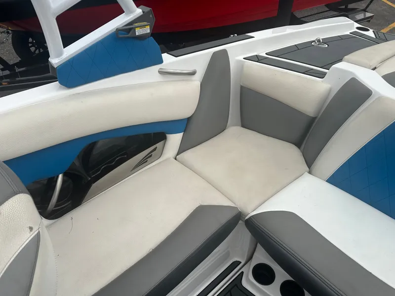 Slide: The Image of Interior of a 2016 Tigé R20 boat with gray and blue seating. - 23