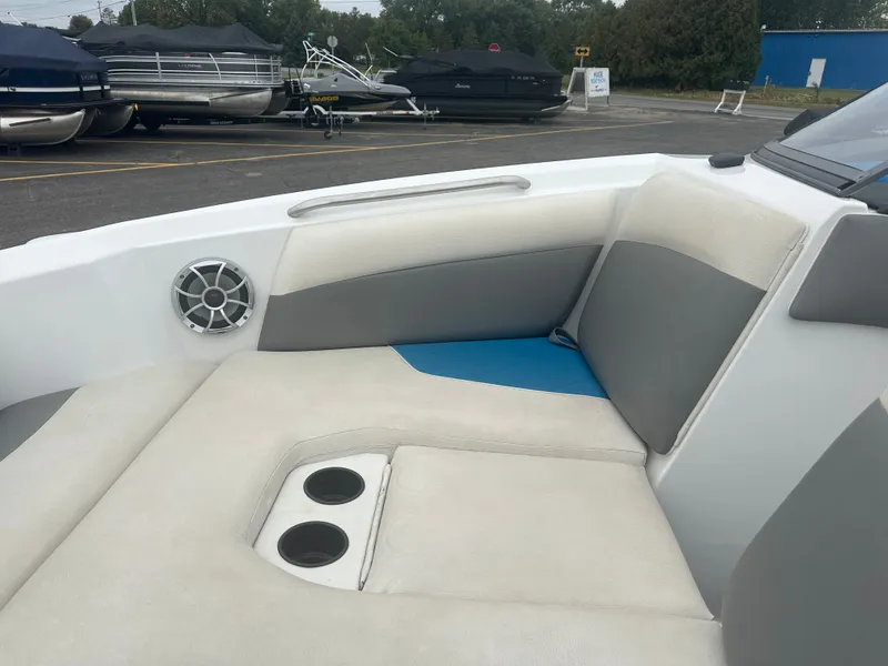 Slide: The Image of Interior of a 2016 Tigé R20 boat with speaker and cup holders. - 29