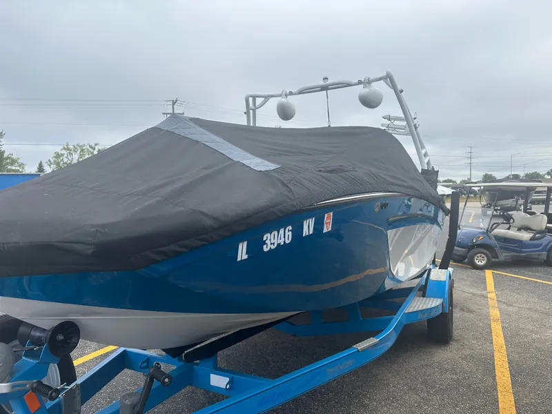 Slide: The Image of 2016 Tigé R20 boat with cover on trailer. - 4