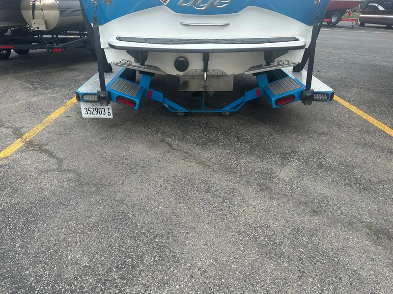 Slide: The Image of Rear view of a 2016 Tigé R20 boat on a trailer. - 7