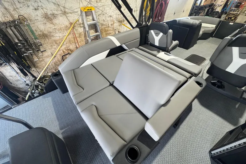 Slide: The Image of Interior of 2026 Evotti 521CS boat with gray seating and cup holders. - 11