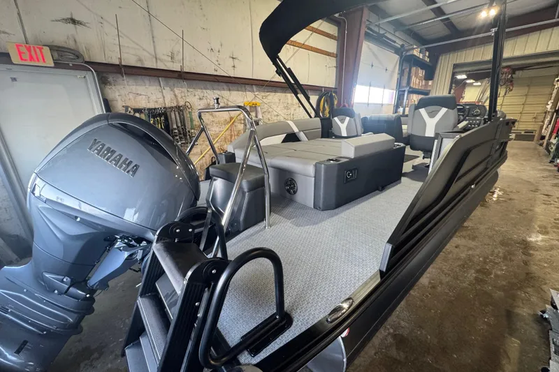 Slide: The Image of 2026 Evotti 521CS boat with Yamaha engine in a garage setting. - 12