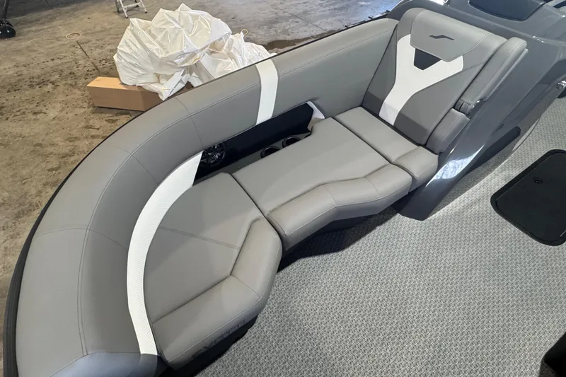 Slide: The Image of Luxurious seating in a 2026 Evotti 521CS boat, featuring sleek gray upholstery. - 2