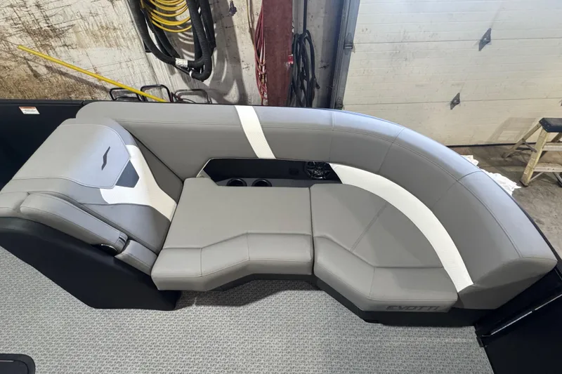 Slide: The Image of Luxurious gray seating in 2026 Evotti 521CS boat, featuring modern design and cup holders. - 3