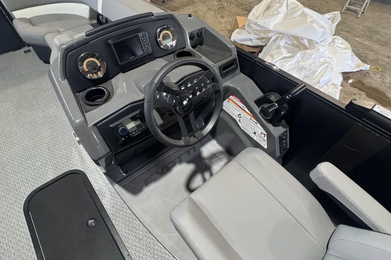 Slide: The Image of Interior of 2026 Evotti 521CS boat, featuring modern steering and control panel. - 5