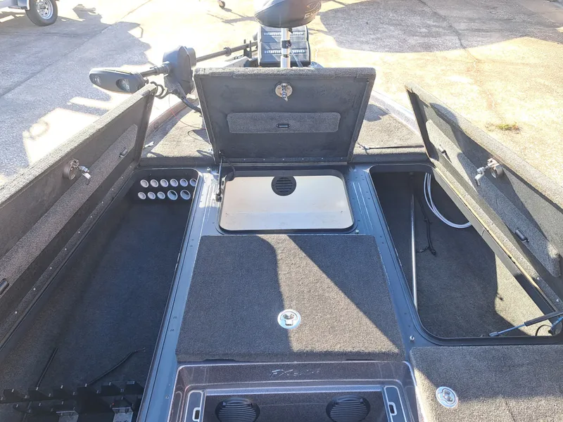 Slide: The Image of Interior view of a 2014 Skeeter FX21 boat with storage compartments. - 13