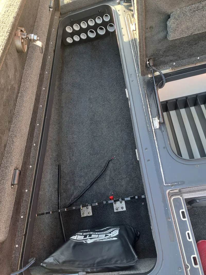 Slide: The Image of Interior of a 2014 Skeeter FX21 boat with storage compartment. - 17