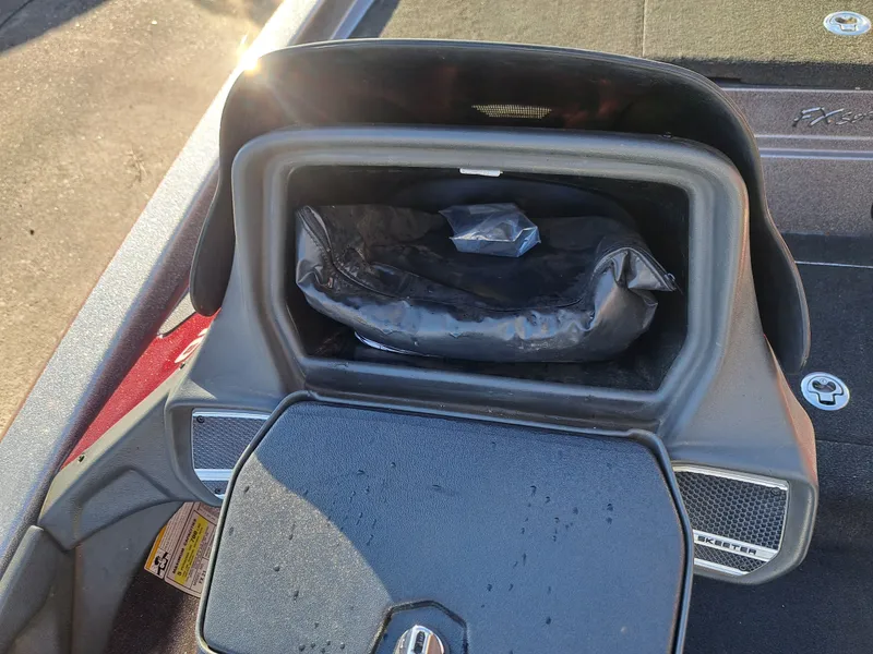 Slide: The Image of Skeeter FX21 2014 boat console with storage compartment. - 30