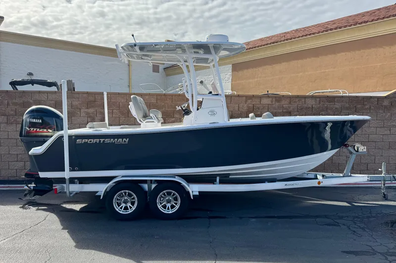 The Image of 2022 Sportsman Open 212 Center Console boat on trailer, side view. - 0