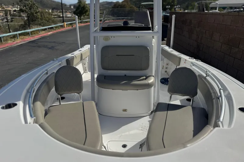 Slide: The Image of 2022 Sportsman Open 212 Center Console boat interior with seating and console view. - 10