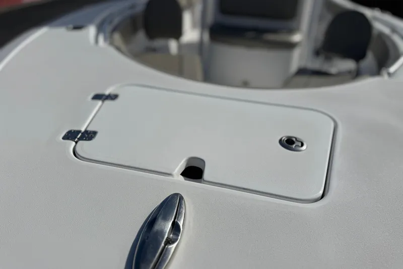 Slide: The Image of 2022 Sportsman Open 212 Center Console boat deck with storage compartment. - 11