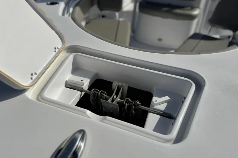 Slide: The Image of Anchor storage compartment on 2022 Sportsman Open 212 Center Console boat. - 12