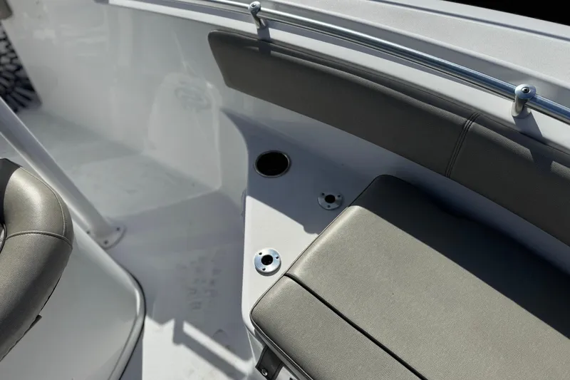Slide: The Image of 2022 Sportsman Open 212 Center Console boat interior with seating and cup holder. - 17