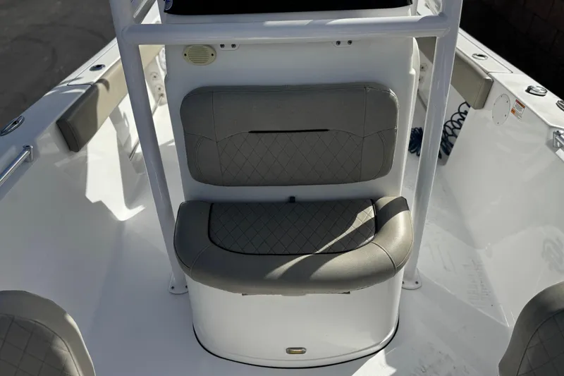 Slide: The Image of 2022 Sportsman Open 212 Center Console boat seating area with cushioned backrest. - 18
