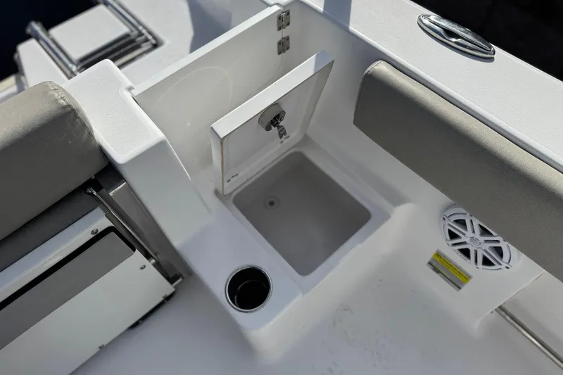 Slide: The Image of 2022 Sportsman Open 212 Center Console boat interior with sink and speaker. - 26