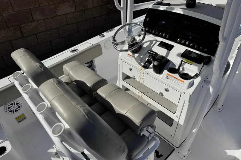 Slide: The Image of 2022 Sportsman Open 212 Center Console boat interior with steering wheel and controls. - 28