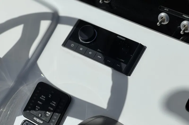 Slide: The Image of Control panel of 2022 Sportsman Open 212 Center Console boat with audio system. - 33