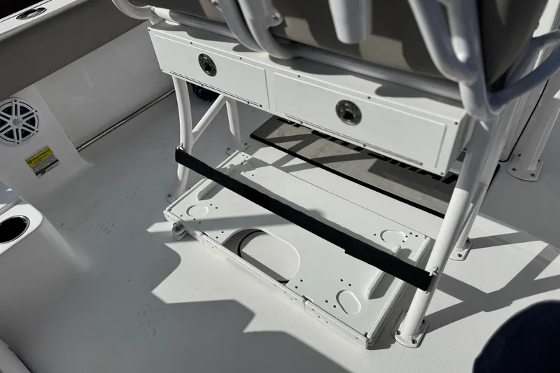 Slide: The Image of 2022 Sportsman Open 212 Center Console boat interior with storage and seating. - 36