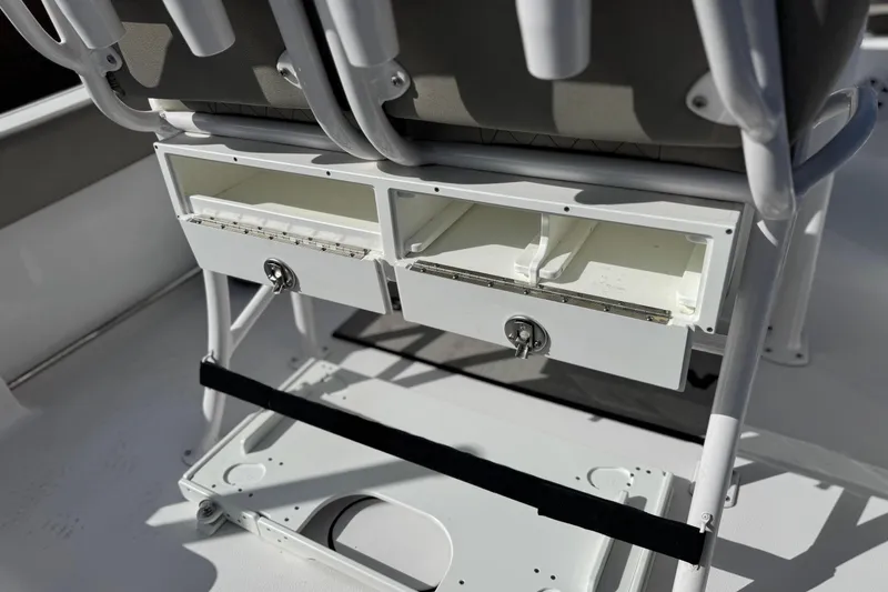 Slide: The Image of 2022 Sportsman Open 212 Center Console storage compartments under seat. - 37