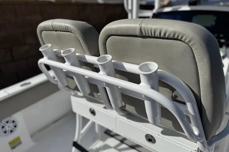 Slide: The Image of 2022 Sportsman Open 212 Center Console boat with rod holders and cushioned seats. - 38