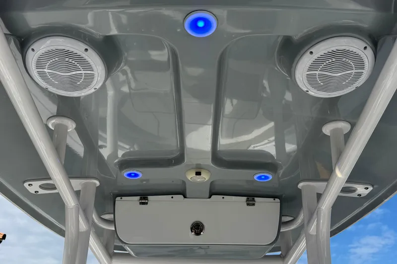 Slide: The Image of 2022 Sportsman Open 212 Center Console boat roof with speakers and blue LED lights. - 40
