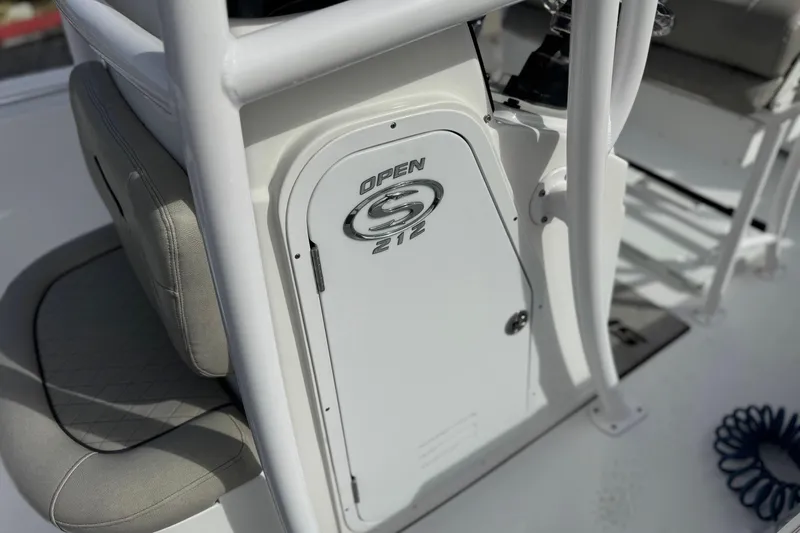 Slide: The Image of 2022 Sportsman Open 212 Center Console boat interior, featuring seating and console details. - 46