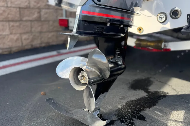 Slide: The Image of 2022 Sportsman Open 212 Center Console boat propeller close-up on pavement. - 7
