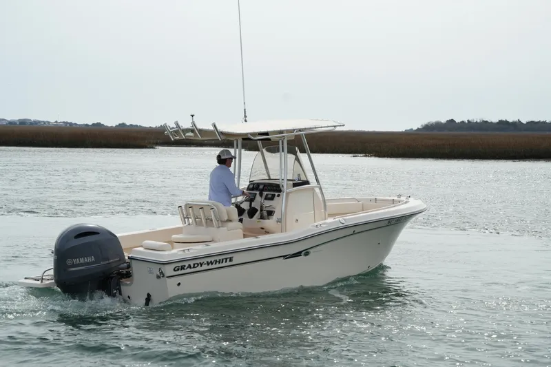 Slide: The Image of 2014 Grady-White Fisherman 209 boat cruising on calm waters. - 10