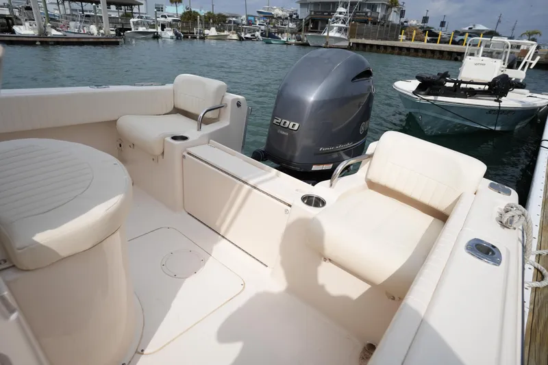 Slide: The Image of 2014 Grady-White Fisherman 209 boat interior with seating and Yamaha outboard motor. - 12