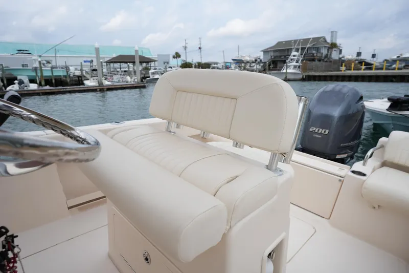 Slide: The Image of 2014 Grady-White Fisherman 209 boat interior with seating and Yamaha 200 engine. - 18