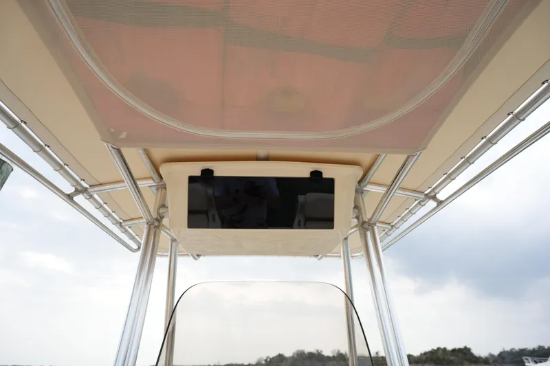 Slide: The Image of 2014 Grady-White Fisherman 209 boat canopy and console, viewed from below. - 20