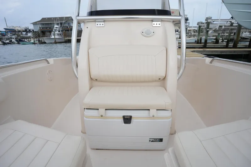 Slide: The Image of 2014 Grady-White Fisherman 209 boat interior with cushioned seating and storage. - 30