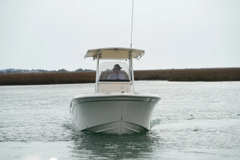 Slide: The Image of 2014 Grady-White Fisherman 209 boat cruising on calm water. - 4