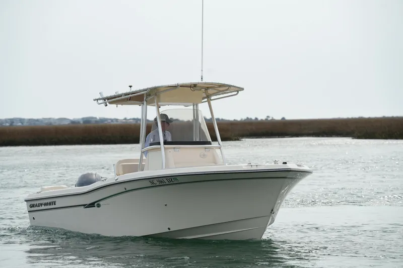 Slide: The Image of 2014 Grady-White Fisherman 209 boat cruising on a calm waterway. - 5