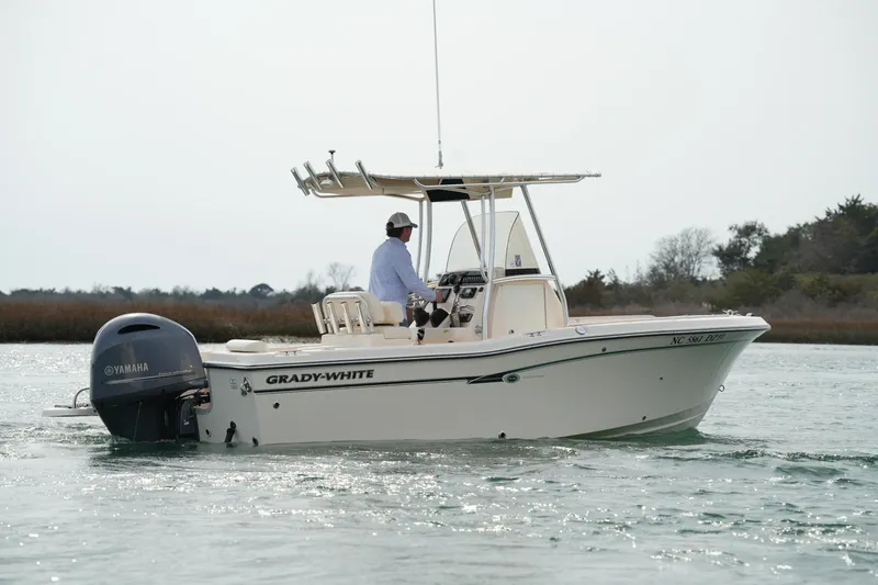 Slide: The Image of 2014 Grady-White Fisherman 209 boat on water with Yamaha engine, side view. - 6