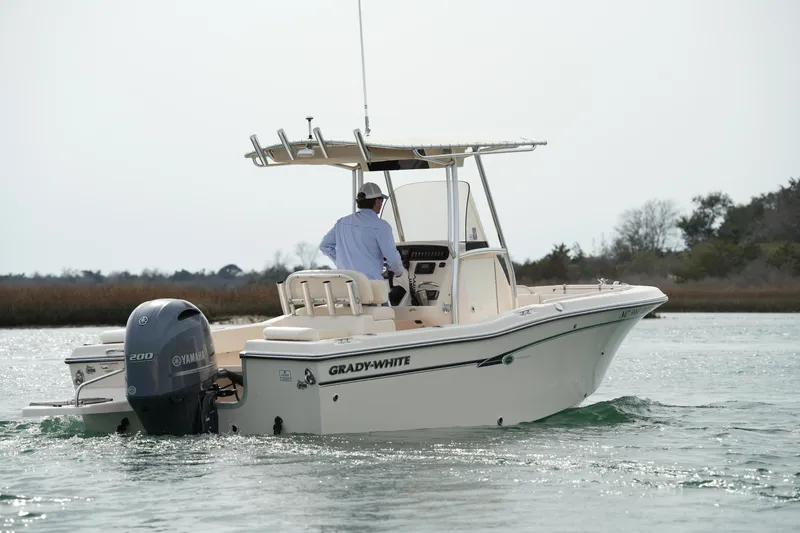 Slide: The Image of 2014 Grady-White Fisherman 209 boat cruising on calm waters. - 8