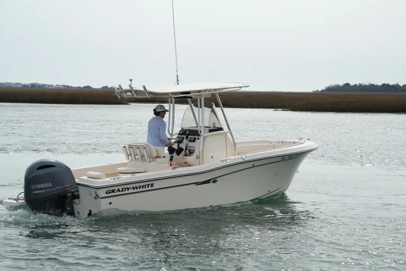 Slide: The Image of 2014 Grady-White Fisherman 209 boat cruising on calm waters. - 9